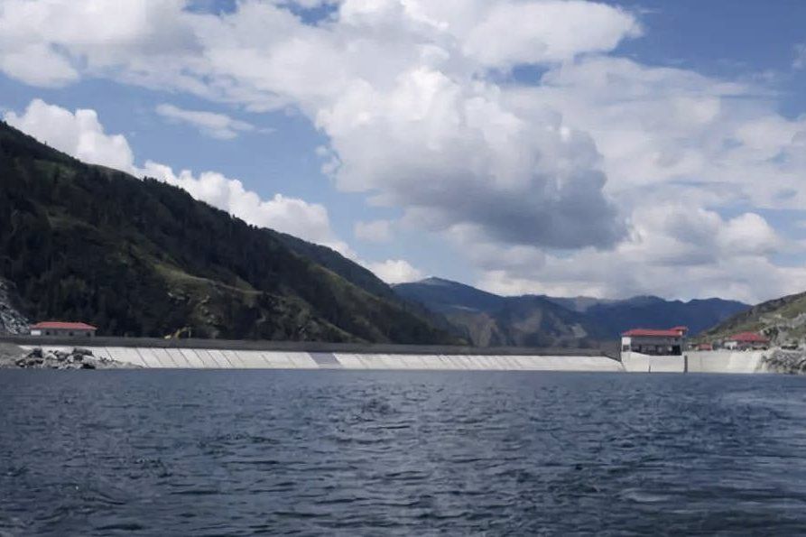 The Kesaiyi reservoir, with the dam beyond