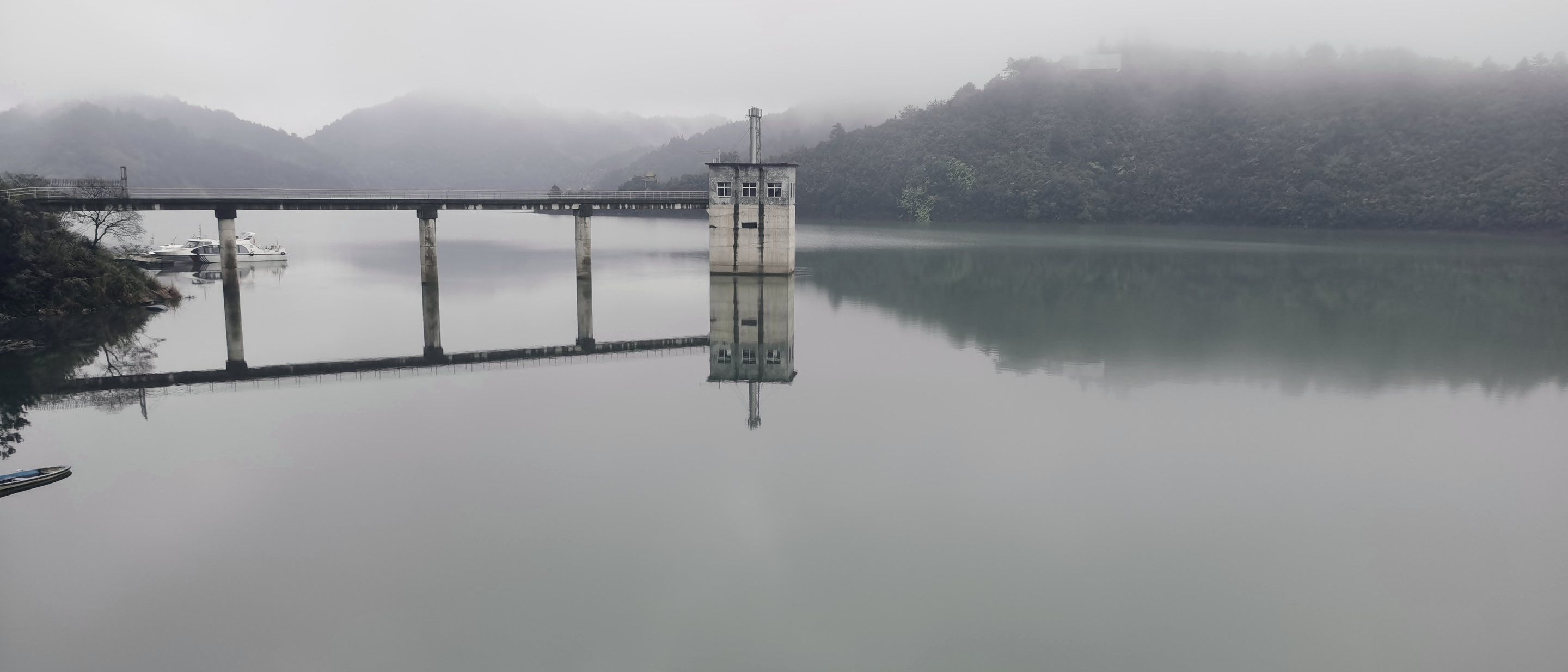 The Taoshui reservoir and intake tower in mist
